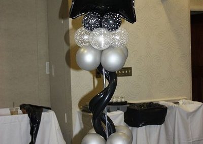 Hollywood Balloon Centerpiece Design with Black Star Foil